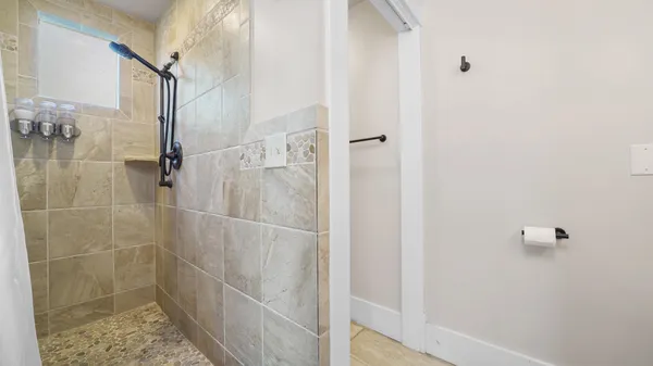 a view of a walk in closet and bedroom view
