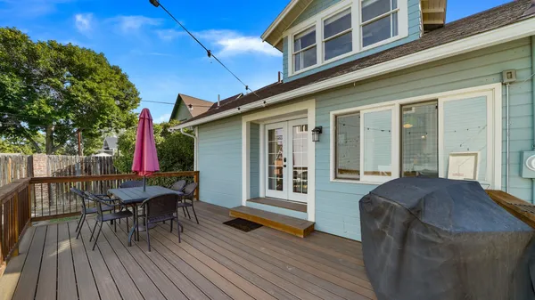 a view of a house with a yard and sitting area