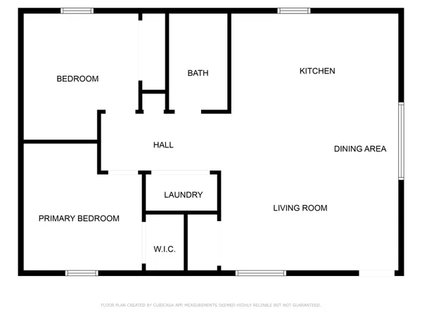 an aerial view of a house with garden space and street view