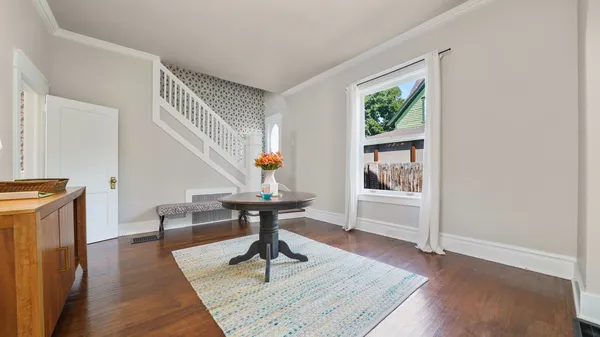 a living room with furniture a fireplace and a table