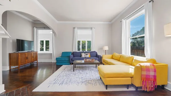 a view of a dining room with furniture wooden floor and chandelier