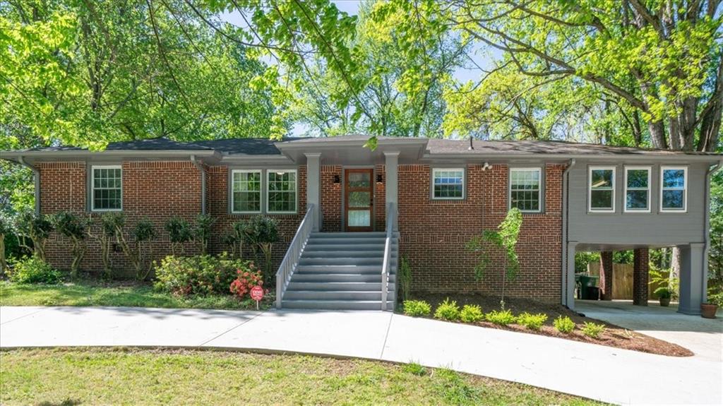 2391 Lavista Road Northeast Atlanta, GA 30329 - Photo 1 of 1 front view of a house with a yard