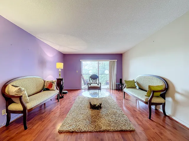 a view of walk in closet with clothes