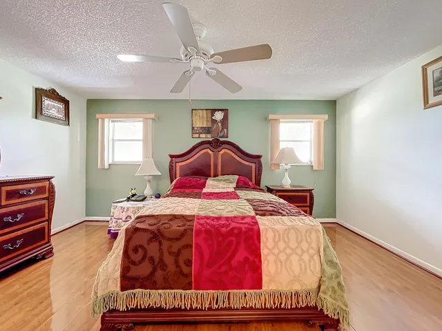 an aerial view of residential houses with outdoor space and lake view