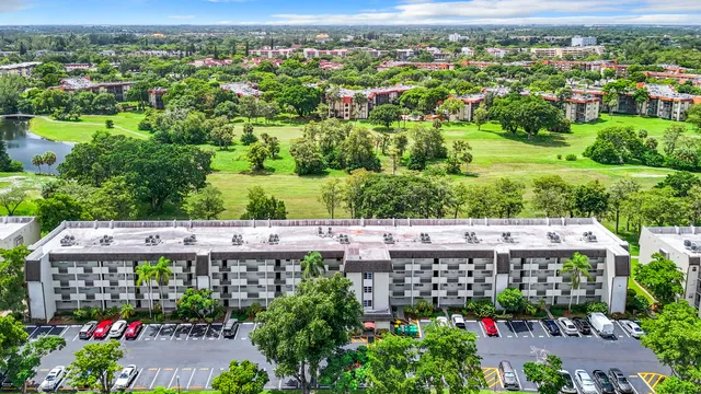 a kitchen with stainless steel appliances granite countertop a sink a stove and microwave