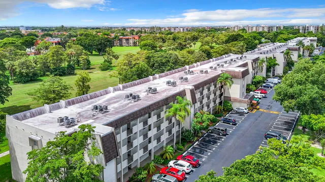a kitchen with cabinets and white appliances
