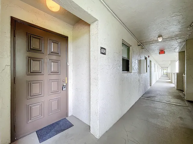 a view of a dining room with furniture wooden floor and chandelier