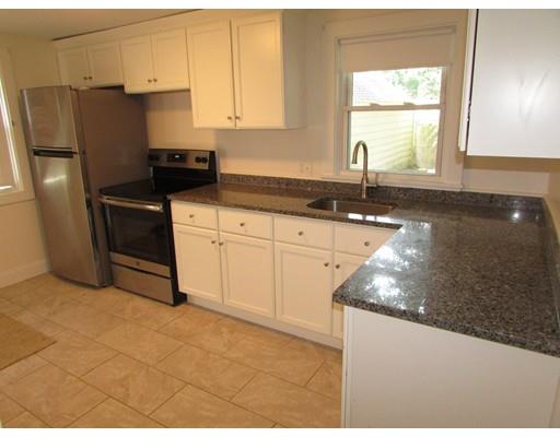 214 Russell Street Springfield, MA 01104 - Photo 8 of 21 a kitchen with granite countertop a sink a stove and refrigerator