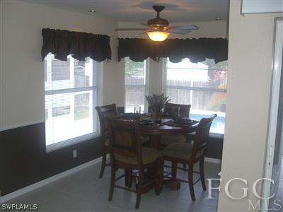 18321 Lee Road Fort Myers, FL 33967 - Photo 3 of 8 a view of a dining room with furniture window and outside view