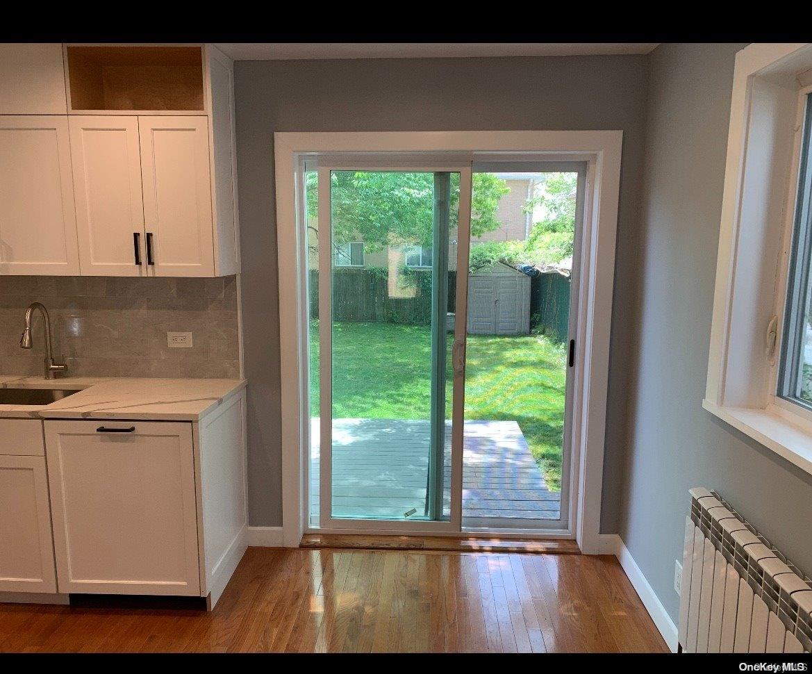 76-22 57th Road Queens, NY 11379 - Photo 4 of 9 a view of walk in closet with large window