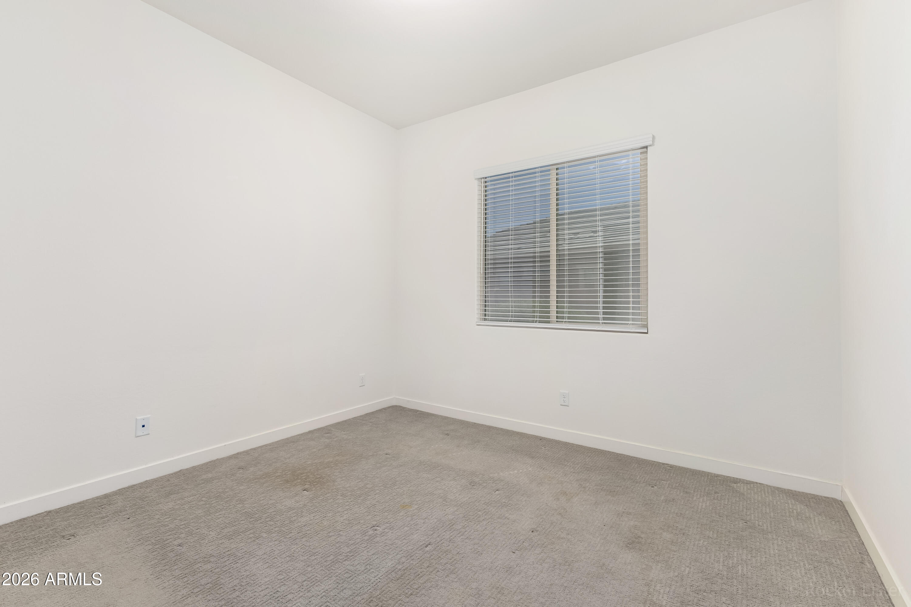 23929 North 166th Lane Surprise, AZ 85387 - Photo 18 of 23 an empty room with a window
