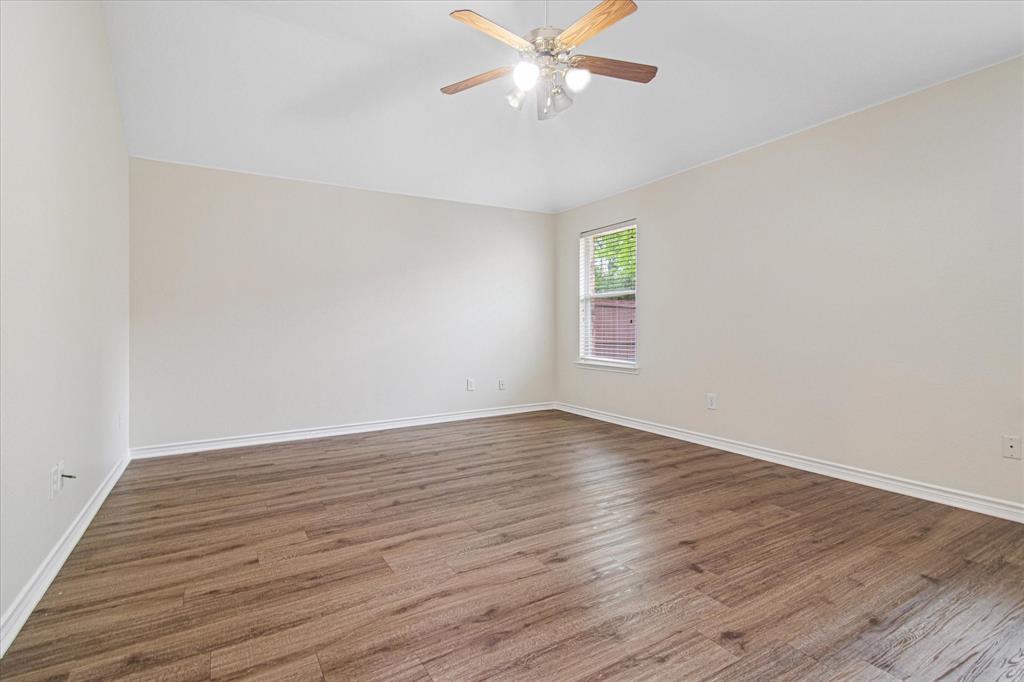 12072 Half Hitch Trail Frisco, TX 75035 - Photo 13 of 25 a view of an empty room with wooden floor and a window