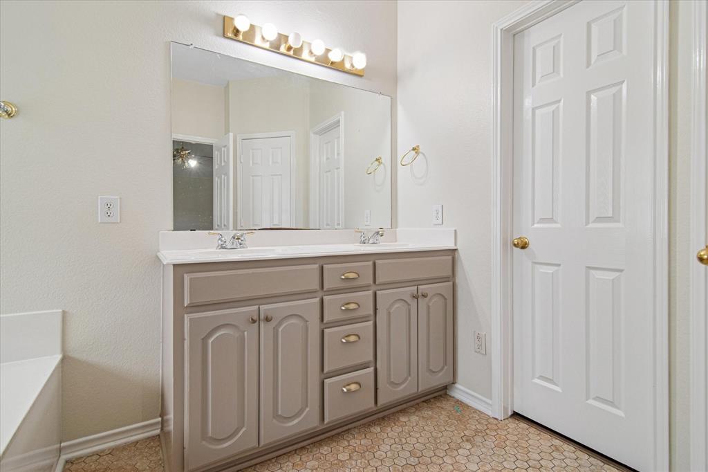 12072 Half Hitch Trail Frisco, TX 75035 - Photo 16 of 25 a bathroom with a sink vanity and mirror
