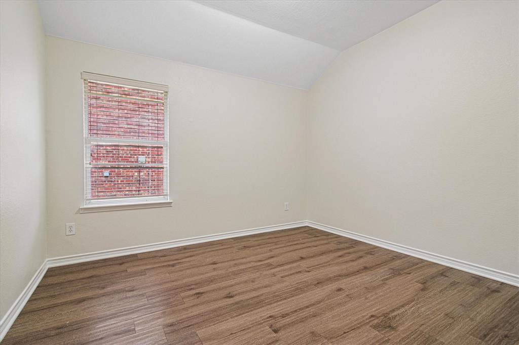 12072 Half Hitch Trail Frisco, TX 75035 - Photo 18 of 25 a view of an empty room with wooden floor and a window
