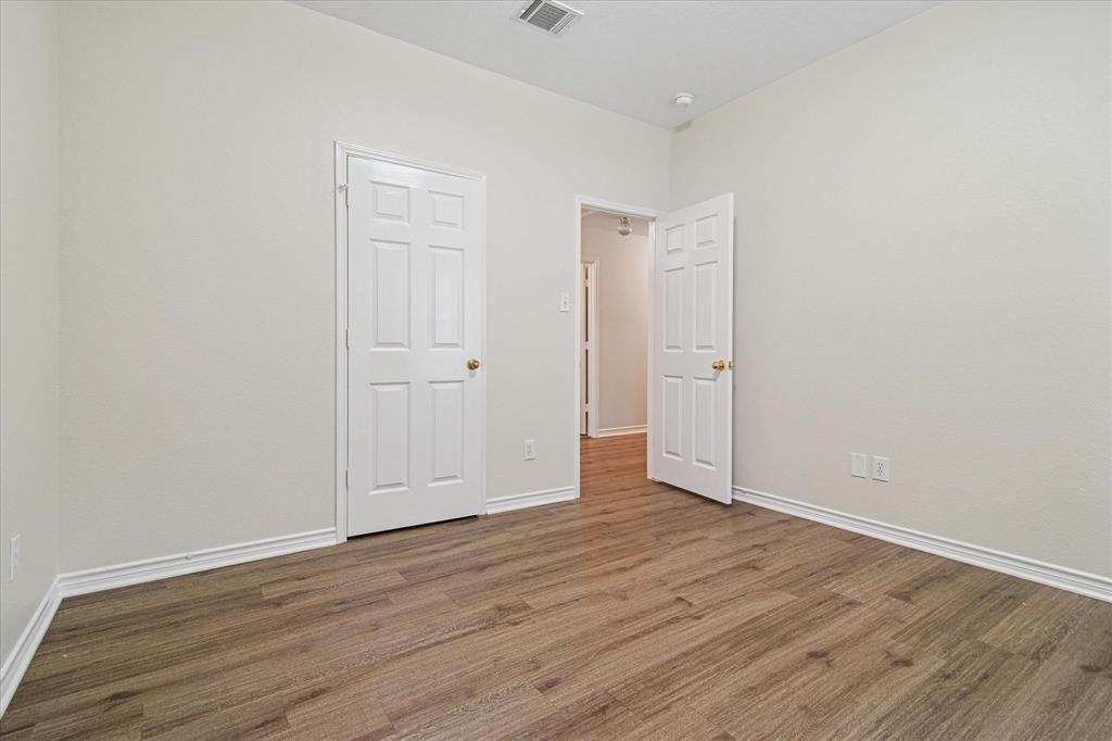 12072 Half Hitch Trail Frisco, TX 75035 - Photo 19 of 25 a view of an empty room with wooden floor