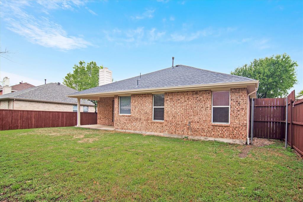 12072 Half Hitch Trail Frisco, TX 75035 - Photo 24 of 25 a front view of house with yard and trees in the background