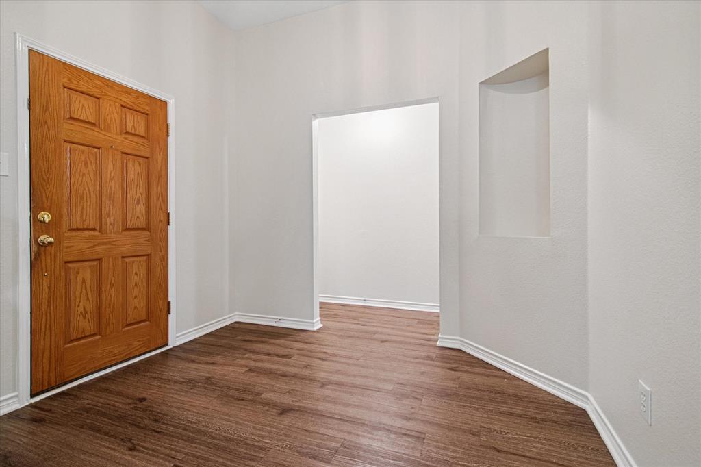 12072 Half Hitch Trail Frisco, TX 75035 - Photo 3 of 25 an empty room with wooden floor and closet area