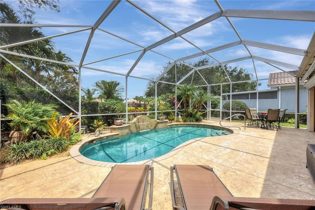 3003 Ellice Way Naples, FL 34119 - Photo 24 of 32 View of swimming pool featuring a patio and a lanai