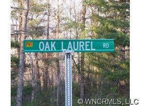 Lot 1 Oak Laurel Road, Unit LOT 1 Brevard, NC 28712 - Photo 12 of 12 a sign on the side of a road