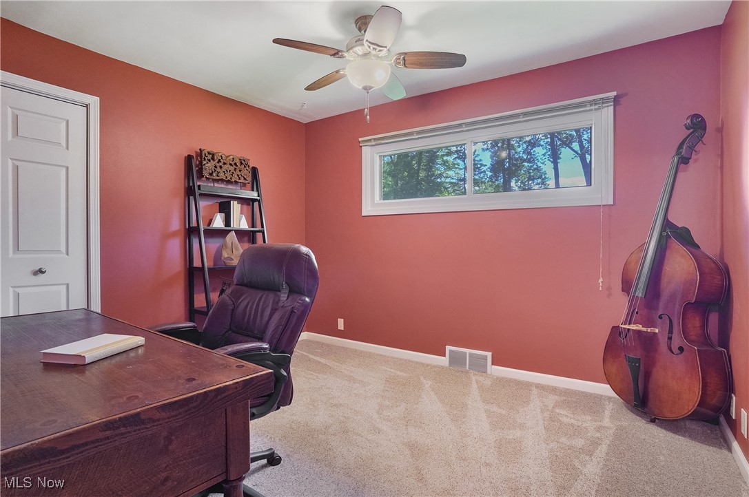 4555 Ranchwood Road Akron, OH 44333 - Photo 21 of 43 Carpeted home office featuring baseboards and ceiling fan