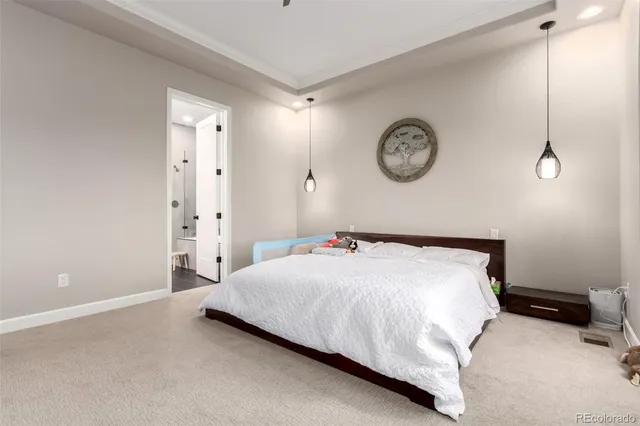 a bedroom with a bed and a table