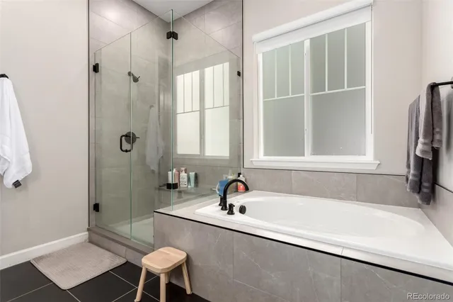 a bathroom with a tub and sink