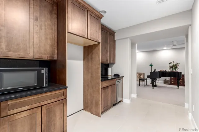 a kitchen with stainless steel appliances granite countertop a stove and a microwave