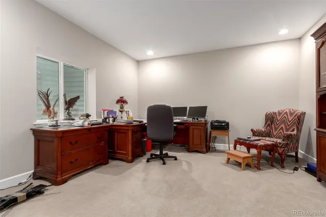 a view of a workspace with furniture