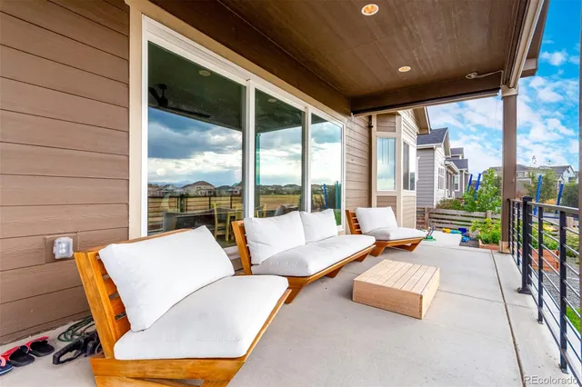 a outdoor space with patio the couches and dining table with garden view