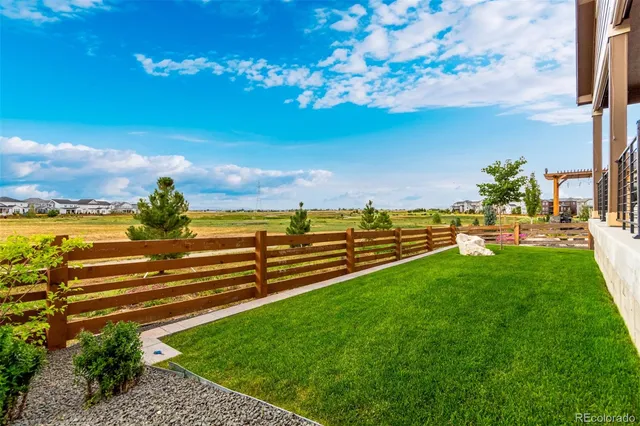 a view of a golf course with a lake