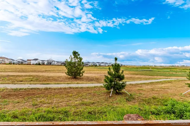 a view of a ocean with a building in the background