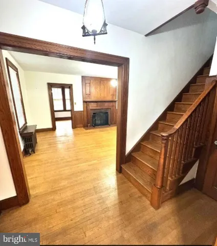 a view of an entryway with wooden floor