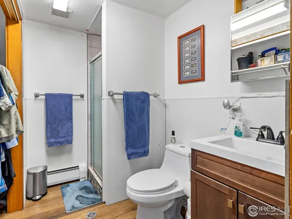 a view of walk in closet and bedroom view