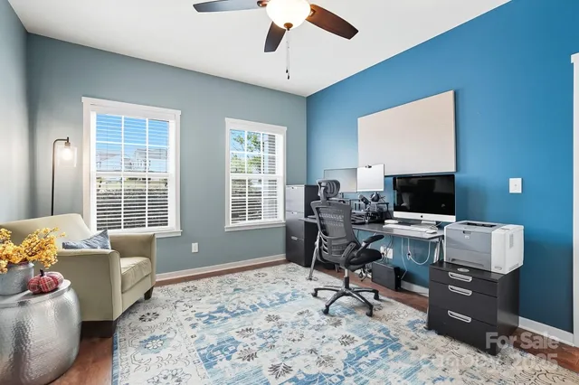 a workspace with furniture and a window