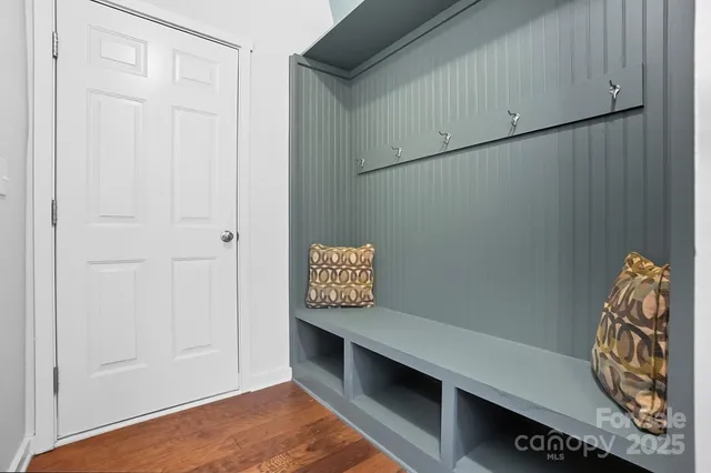 a view of room with window and wooden floor