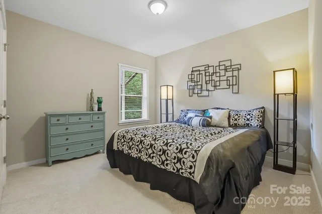 a bathroom with a granite countertop toilet and a sink