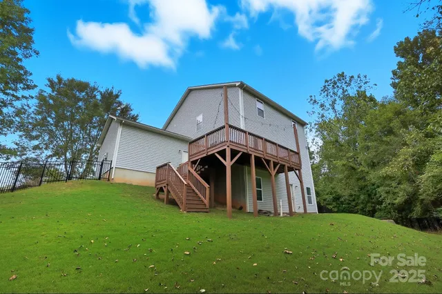 a view of balcony with wooden floor and fence