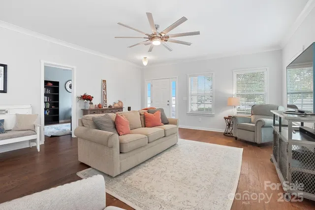 a living room with furniture and white walls