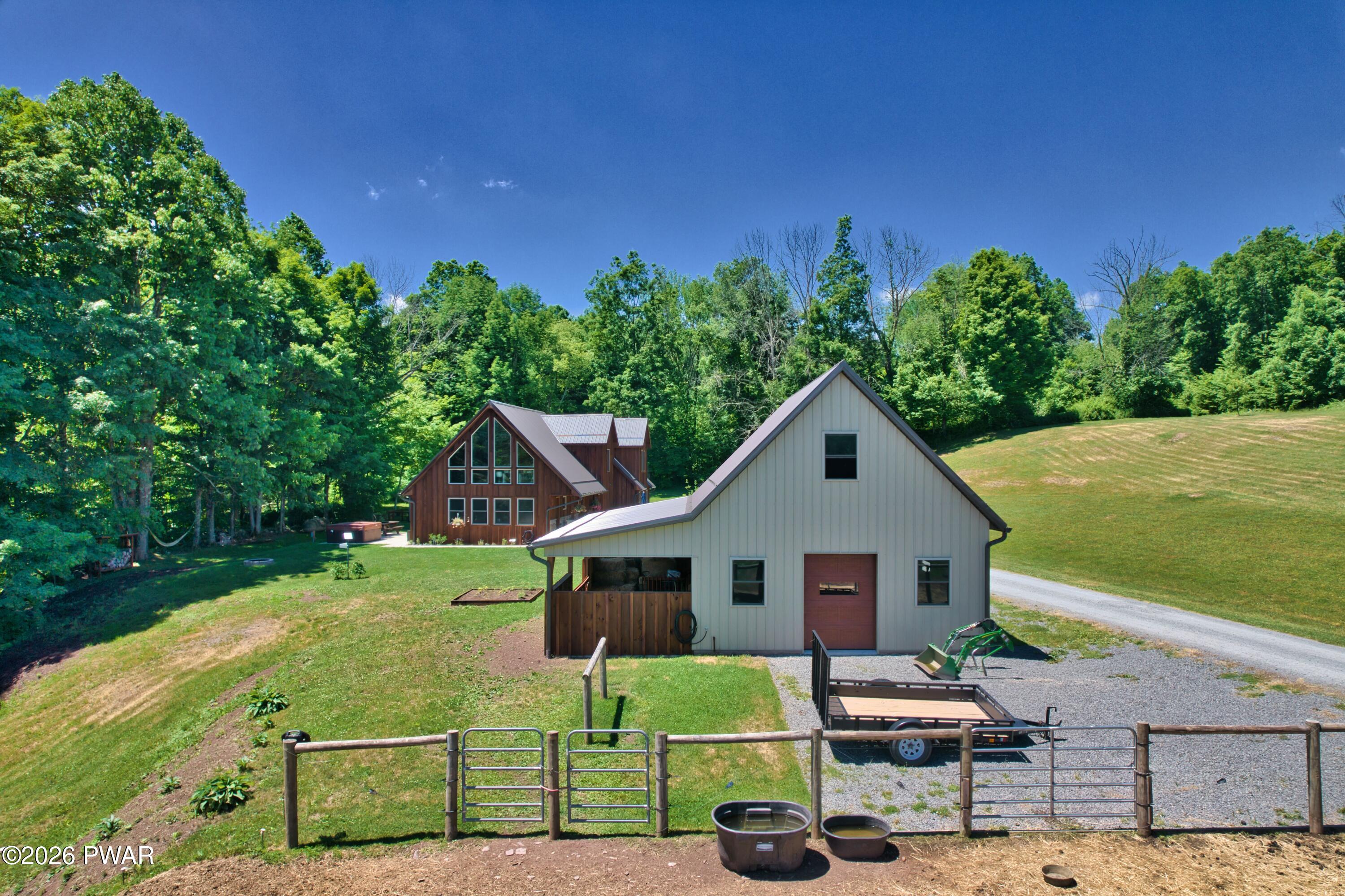 149 Sheards Road Milanville, PA 18443 - Photo 56 of 57 a front view of a house with garden
