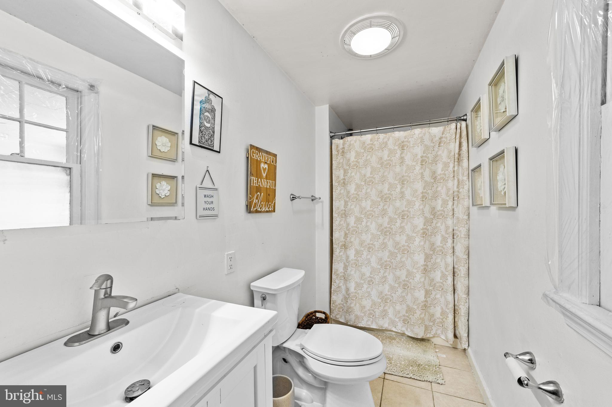 22 James Place Hamilton, NJ 08690 - Photo 13 of 23 a bathroom with a sink toilet and shower