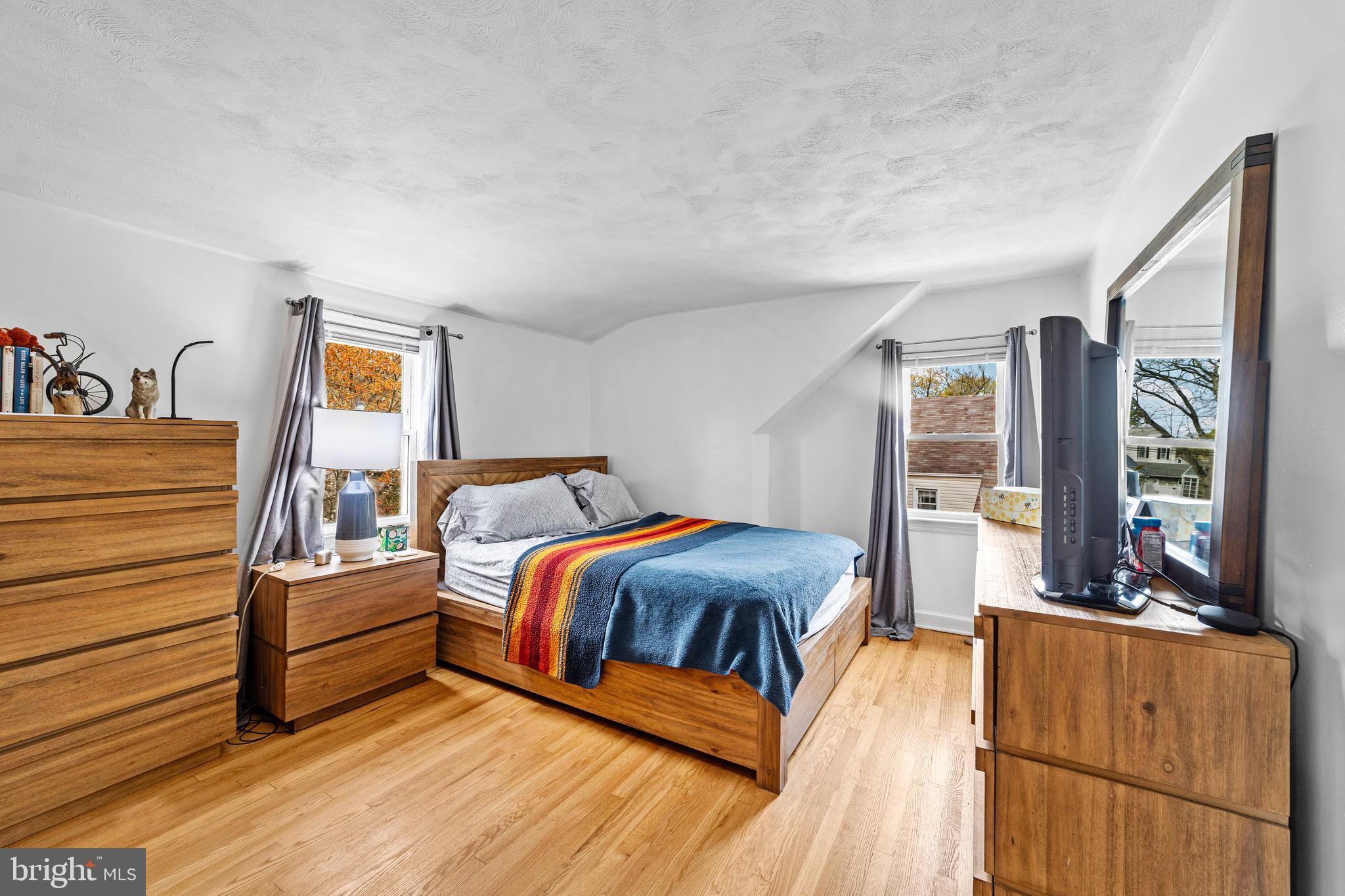 22 James Place Hamilton, NJ 08690 - Photo 19 of 23 a bedroom with a bed and wooden floor