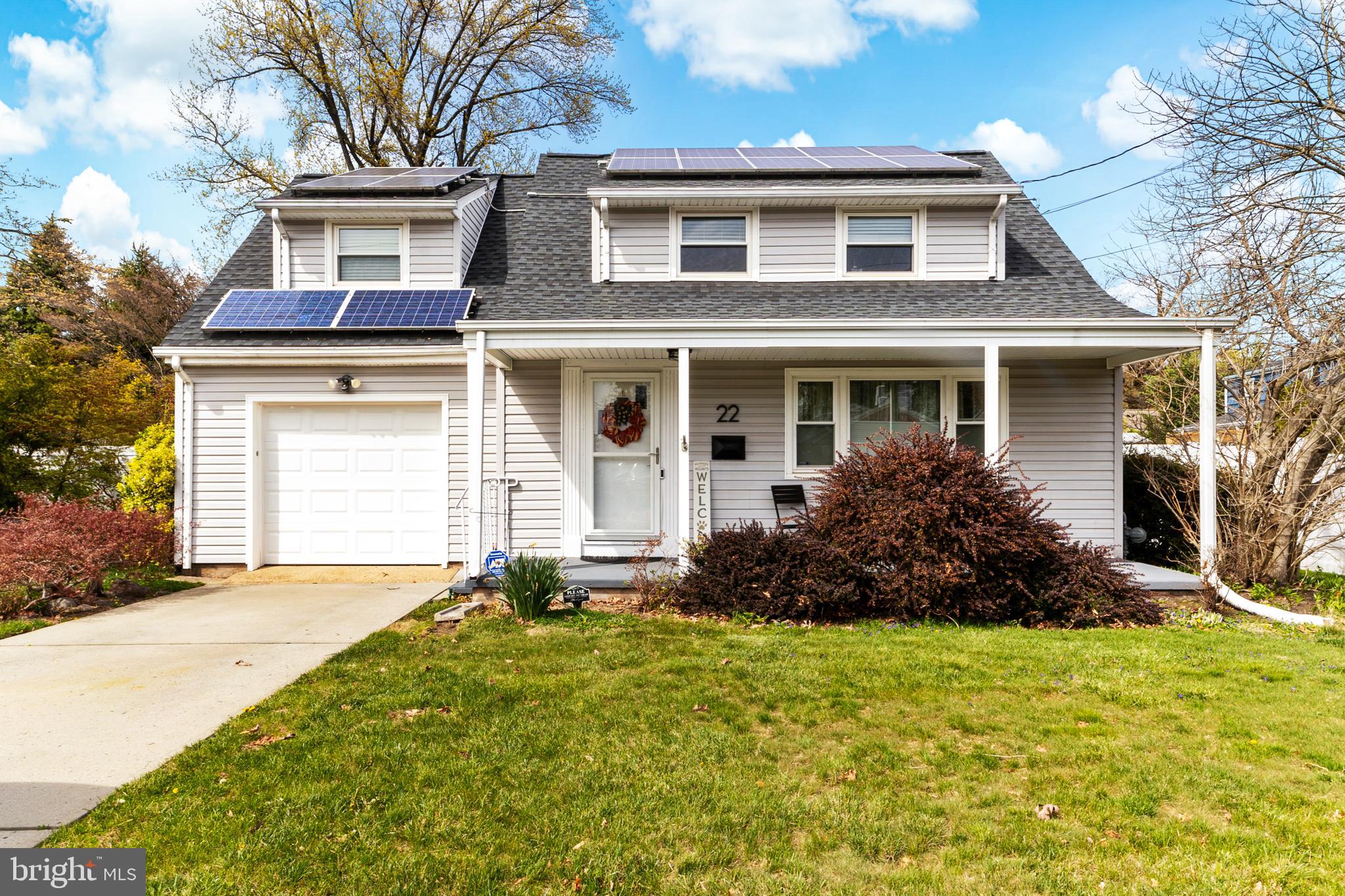 22 James Place Hamilton, NJ 08690 - Photo 2 of 23 a front view of a house with a yard