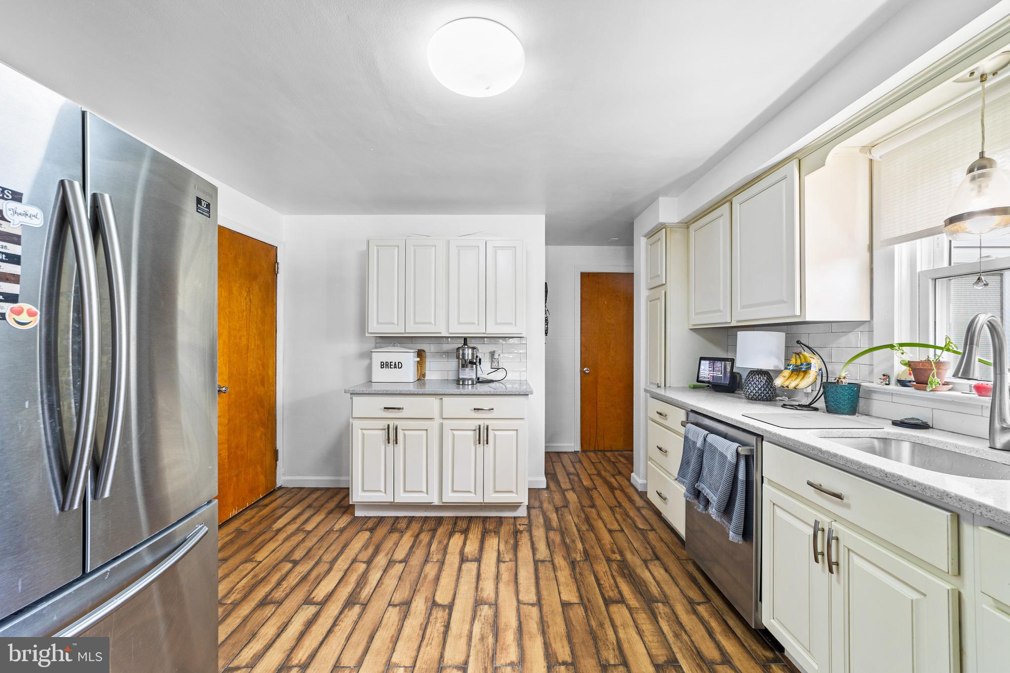 22 James Place Hamilton, NJ 08690 - Photo 8 of 23 a kitchen with stainless steel appliances a refrigerator sink and cabinets