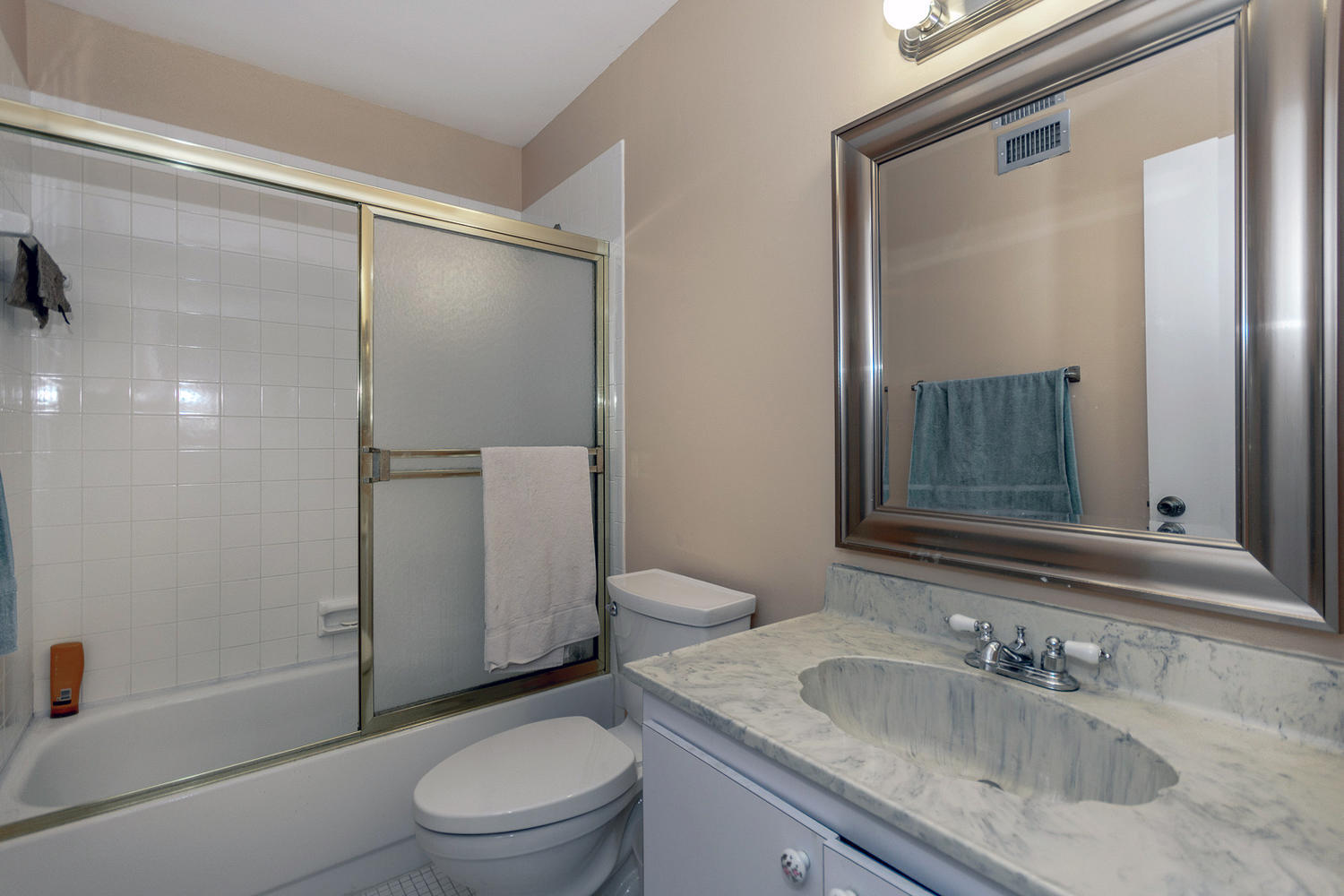9370 Southwest 61st Way, Unit A Boca Raton, FL 33428 - Photo 12 of 19 a bathroom with a granite countertop sink toilet and shower