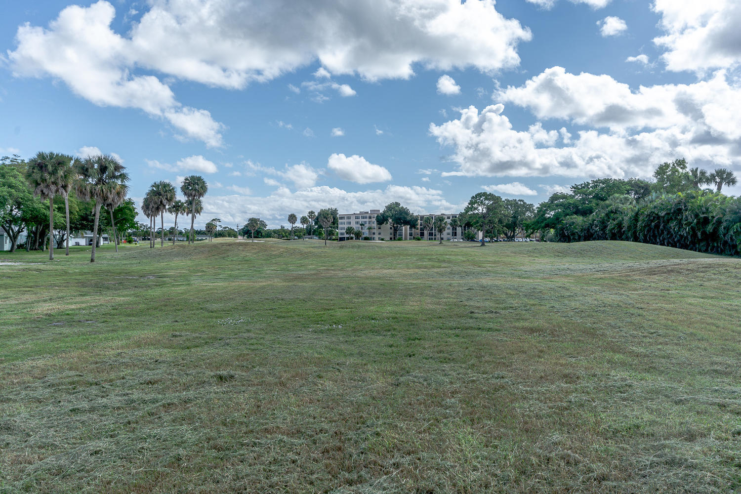 9370 Southwest 61st Way, Unit A Boca Raton, FL 33428 - Photo 17 of 19 a view of a field with trees in the background