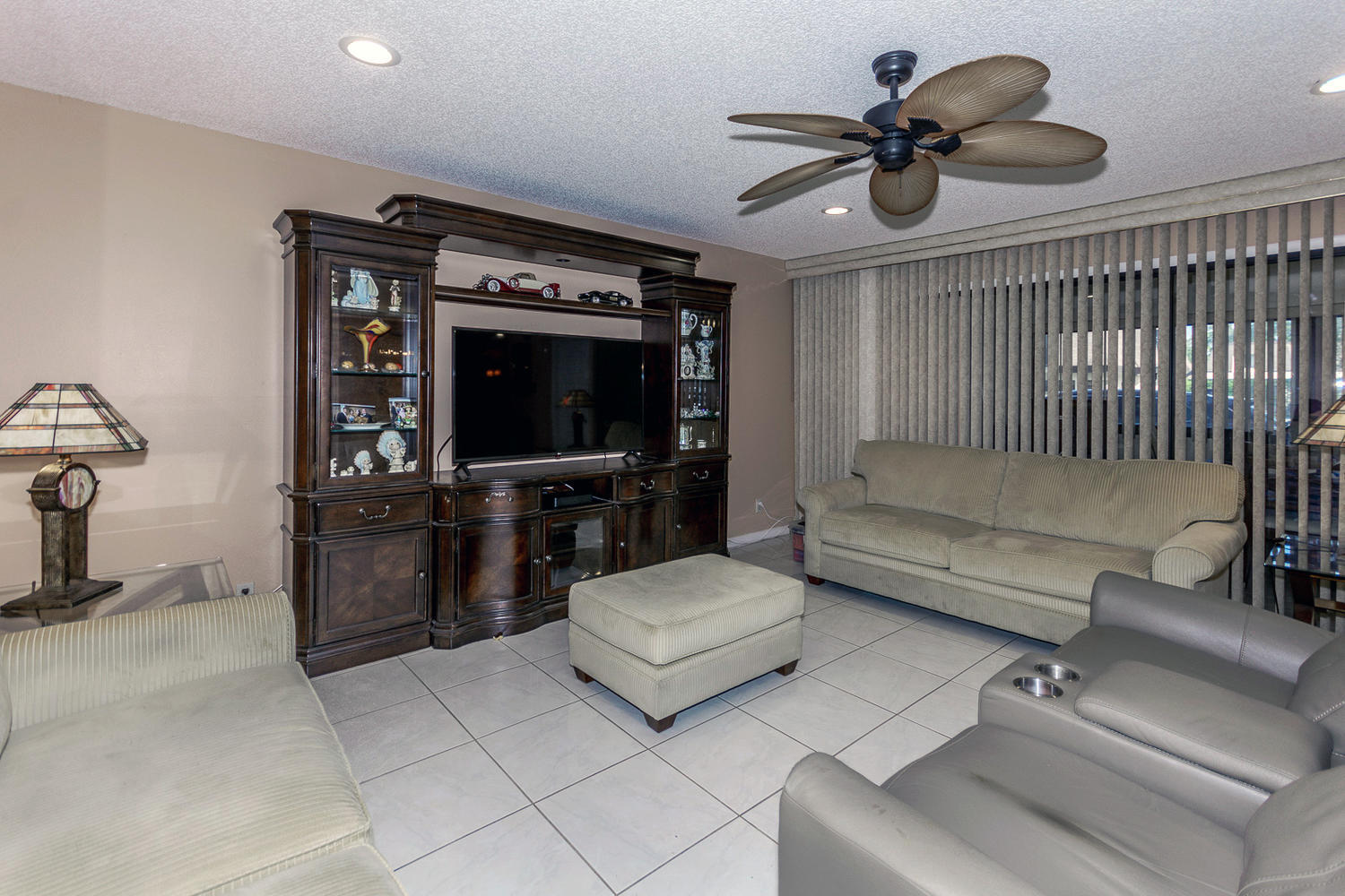 9370 Southwest 61st Way, Unit A Boca Raton, FL 33428 - Photo 3 of 19 a living room with furniture and a flat screen tv