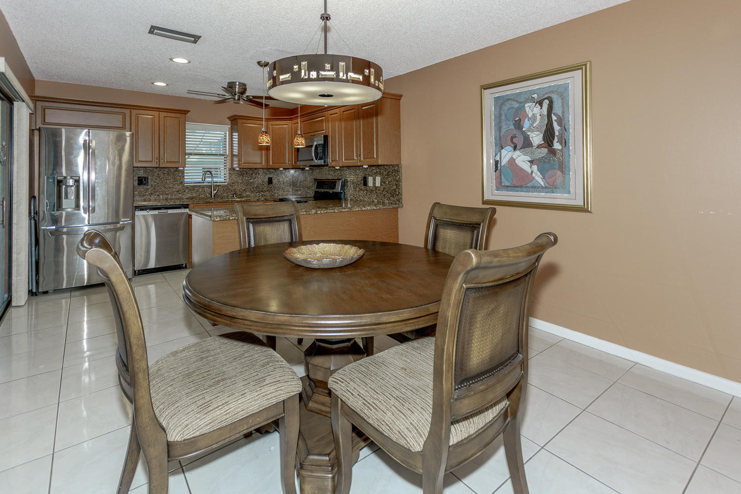 9370 Southwest 61st Way, Unit A Boca Raton, FL 33428 - Photo 4 of 19 a view of a dining room with furniture and wooden floor