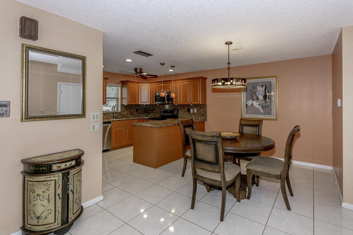 9370 Southwest 61st Way, Unit A Boca Raton, FL 33428 - Photo 5 of 19 a view of a dining room with furniture