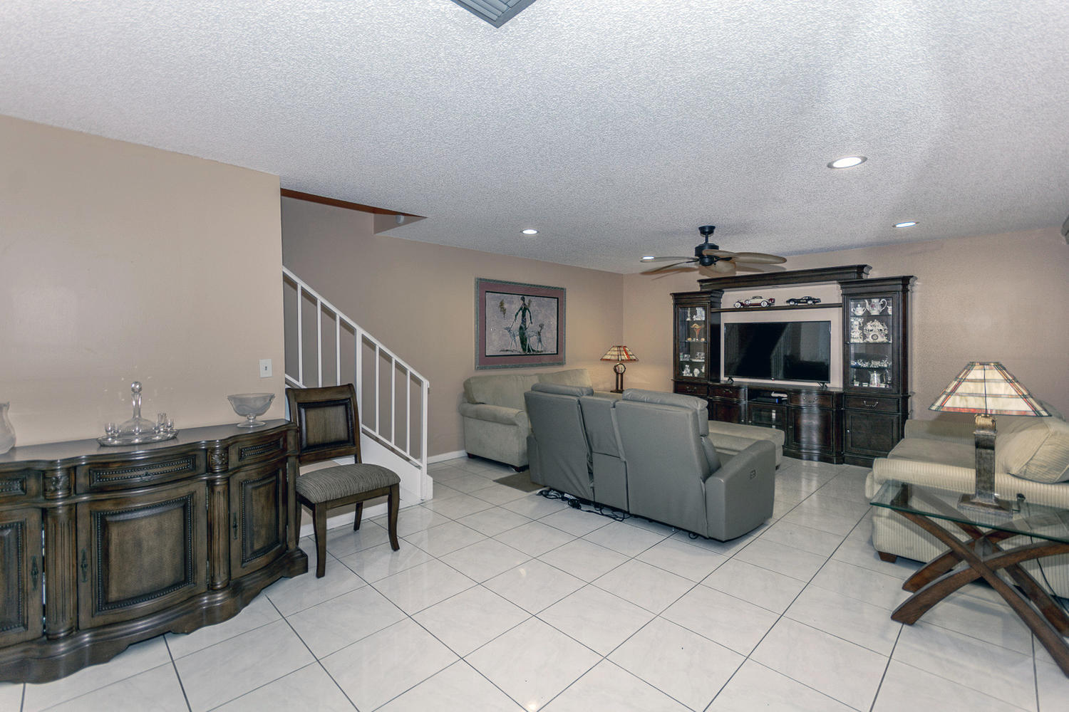 9370 Southwest 61st Way, Unit A Boca Raton, FL 33428 - Photo 19 of 19 a living room with furniture and a flat screen tv