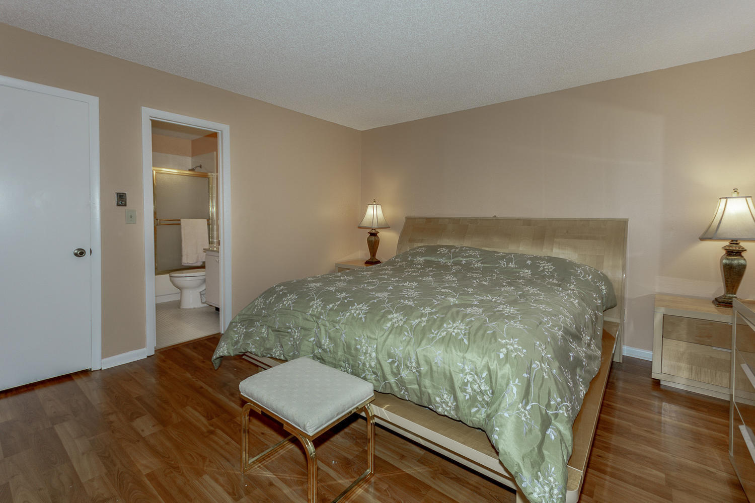 9370 Southwest 61st Way, Unit A Boca Raton, FL 33428 - Photo 9 of 19 a bedroom with a bed and a lamp on table